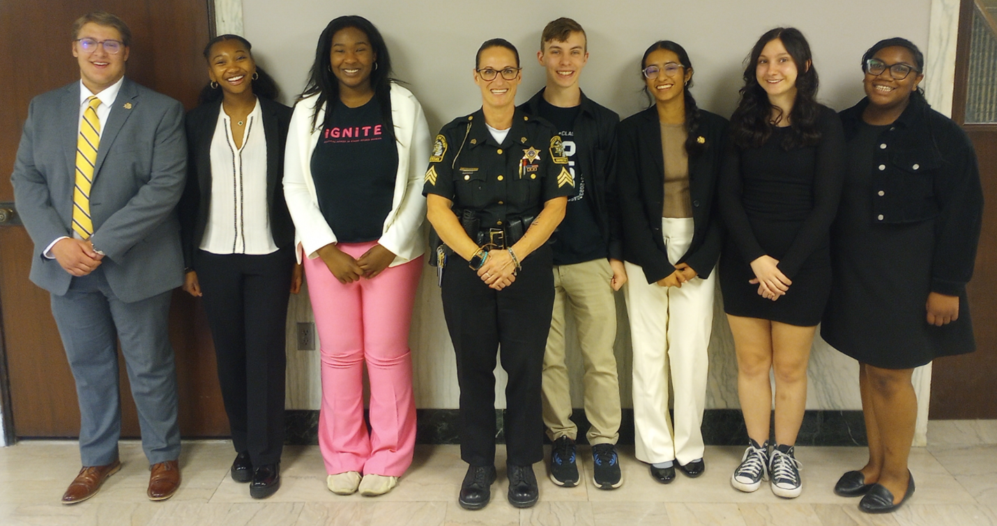 A group of young people with a police officer.